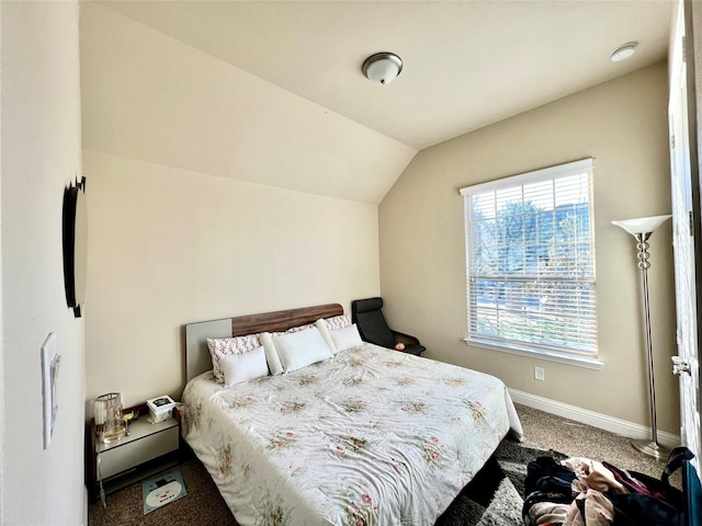 carpeted bedroom featuring vaulted ceiling