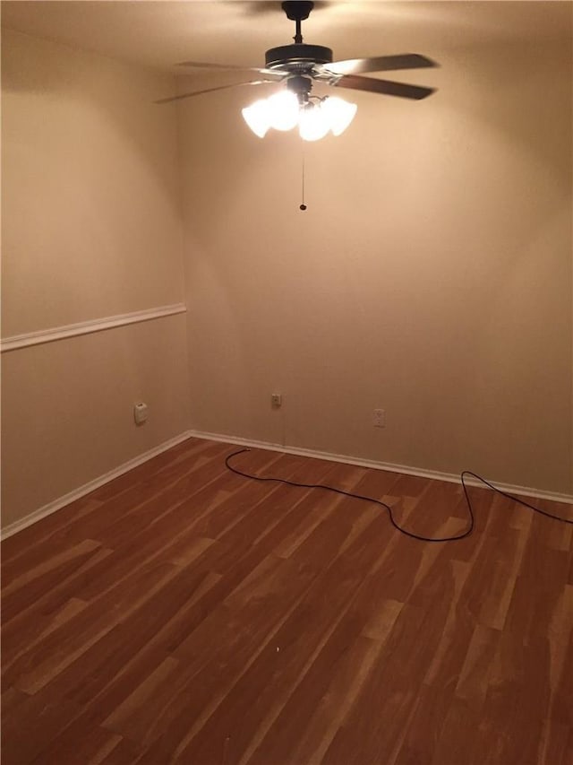 unfurnished room with ceiling fan and wood-type flooring