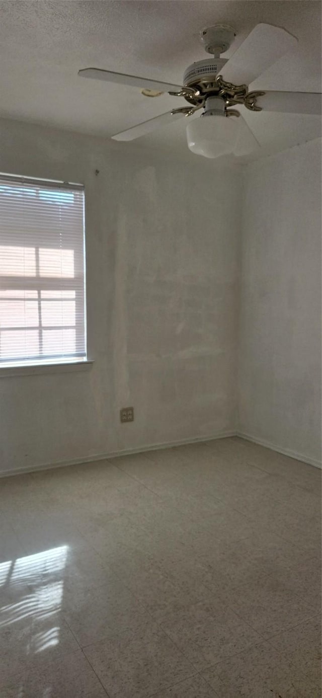 unfurnished room featuring ceiling fan