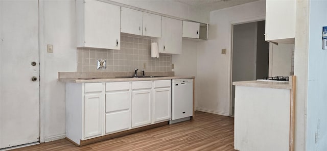 kitchen featuring white cabinetry, sink, white appliances, and light wood-type flooring