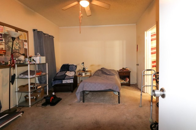 bedroom featuring ceiling fan and carpet