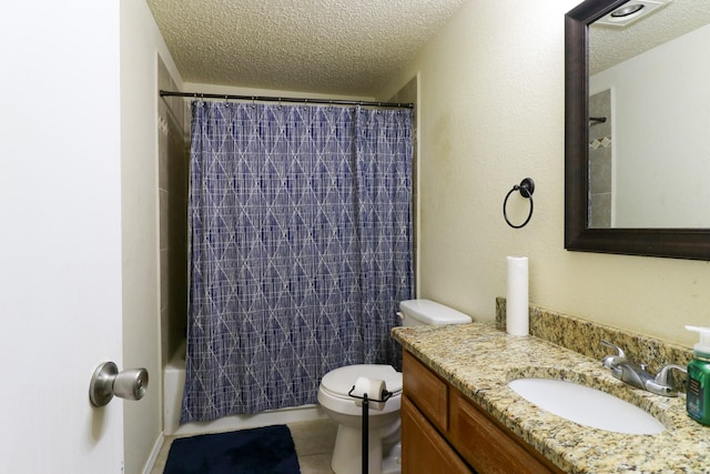 full bathroom with tile patterned floors, vanity, a textured ceiling, shower / bath combo with shower curtain, and toilet