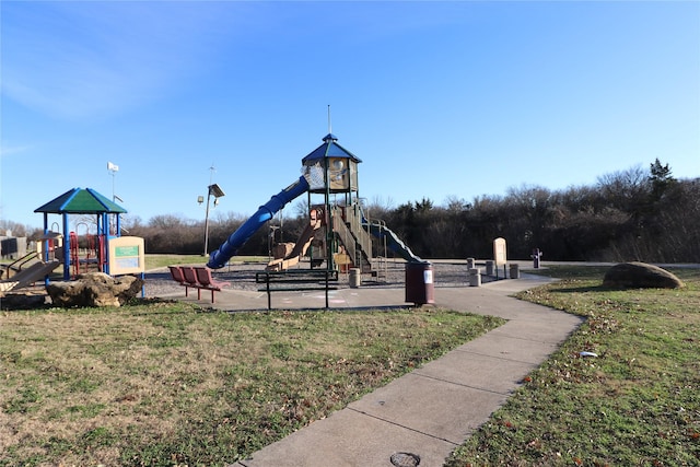 view of playground with a lawn