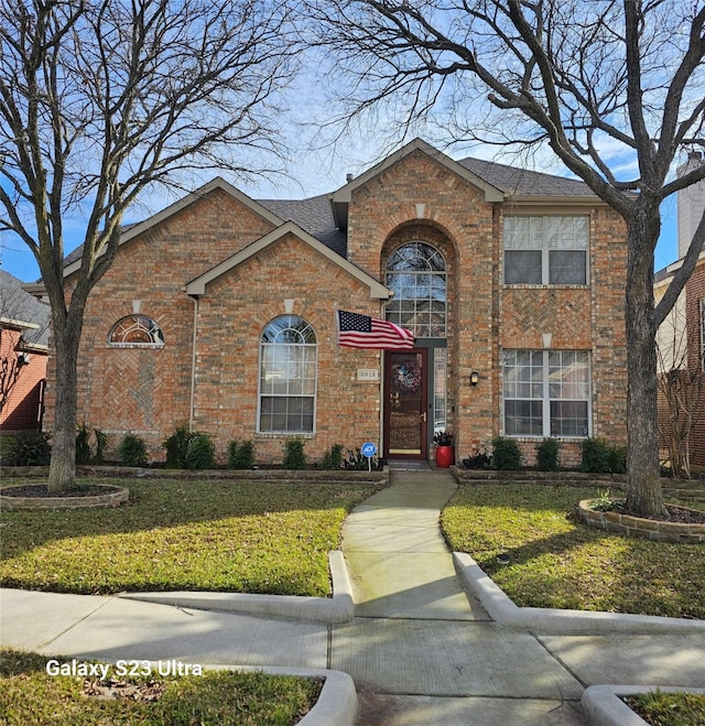 front facade with a front yard