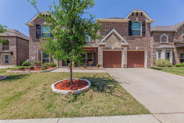 view of front of home with a front yard and a garage