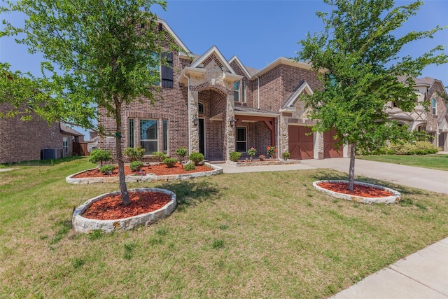 craftsman house featuring a front yard and central air condition unit