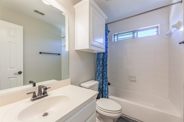 full bathroom with vanity, toilet, and shower / bath combo with shower curtain