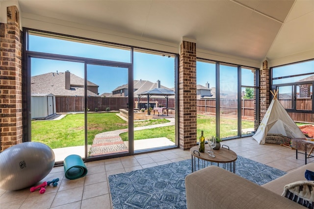 sunroom / solarium with lofted ceiling