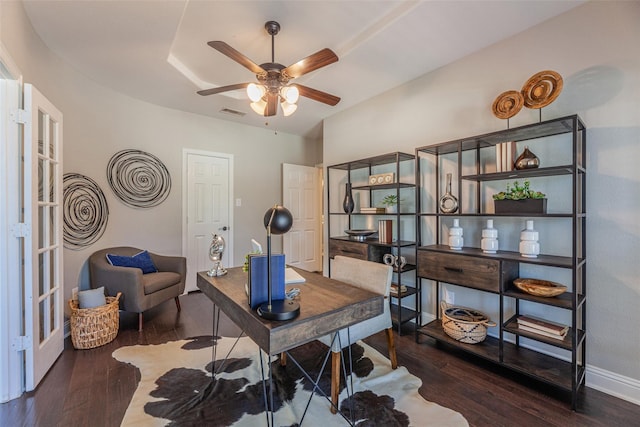 office space featuring ceiling fan and dark hardwood / wood-style flooring