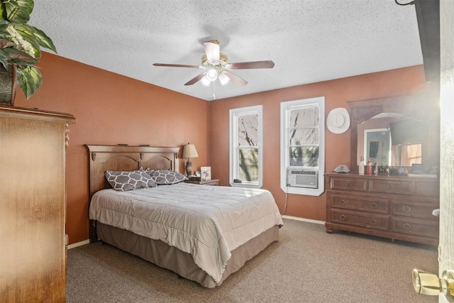 bedroom featuring ceiling fan, cooling unit, light colored carpet, and a textured ceiling