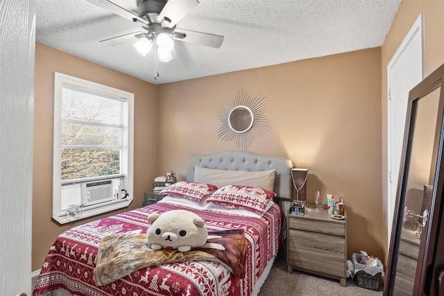 carpeted bedroom with ceiling fan, cooling unit, and a textured ceiling