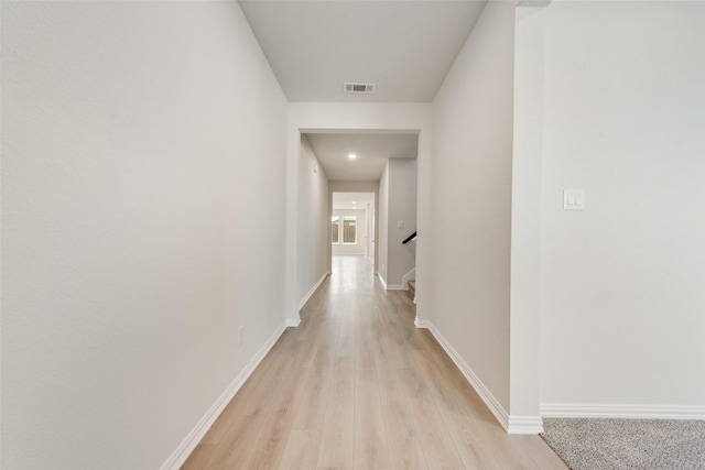 hallway featuring light hardwood / wood-style flooring