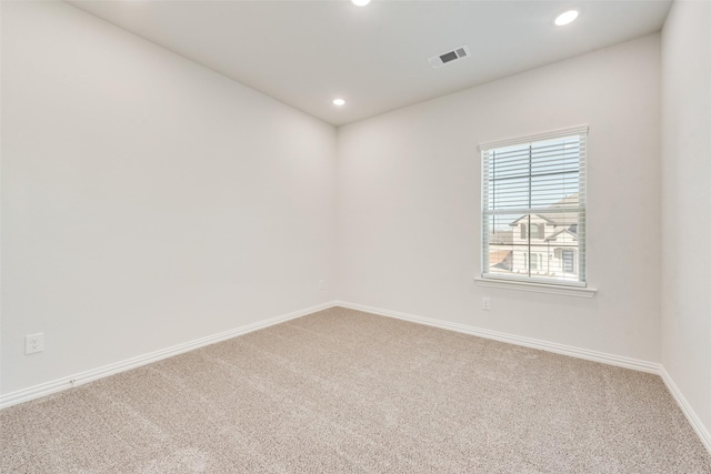 unfurnished room featuring carpet