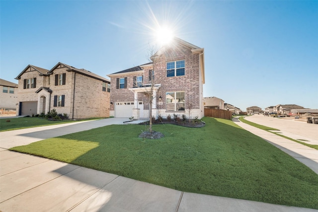 view of front of home with a garage and a front lawn