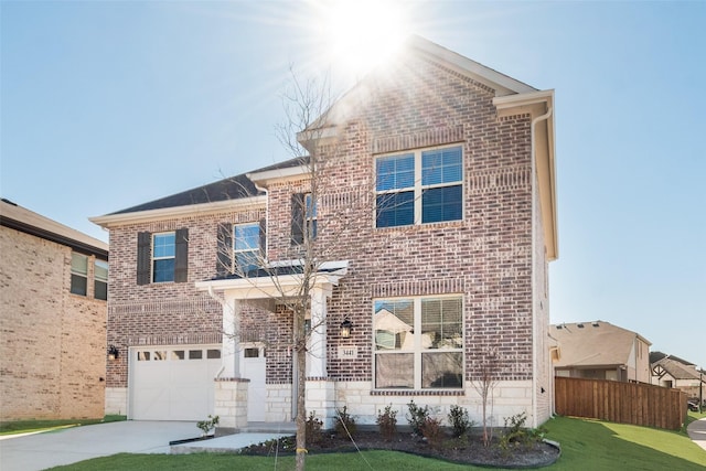 view of front of house with a garage and a front lawn