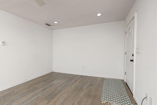 empty room featuring wood-type flooring