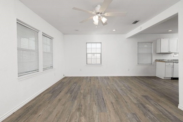 unfurnished living room with dark hardwood / wood-style floors and ceiling fan