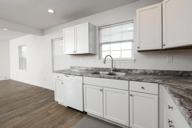 kitchen with a textured ceiling, white dishwasher, dark wood-type flooring, sink, and white cabinetry