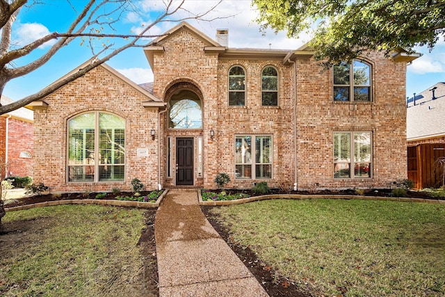 view of front of home with a front yard