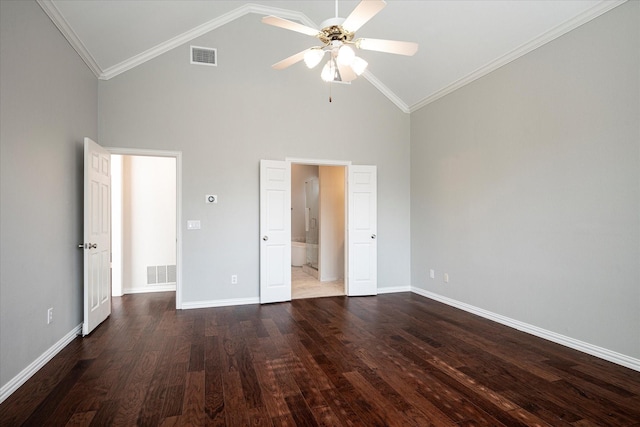 unfurnished bedroom featuring ensuite bathroom, ceiling fan, dark wood-type flooring, high vaulted ceiling, and crown molding