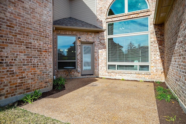 property entrance with a patio