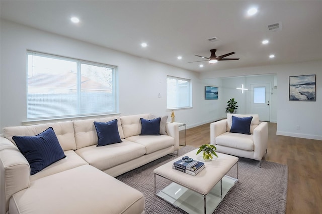 living room with hardwood / wood-style floors and ceiling fan