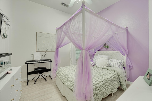 bedroom with light hardwood / wood-style floors and ceiling fan