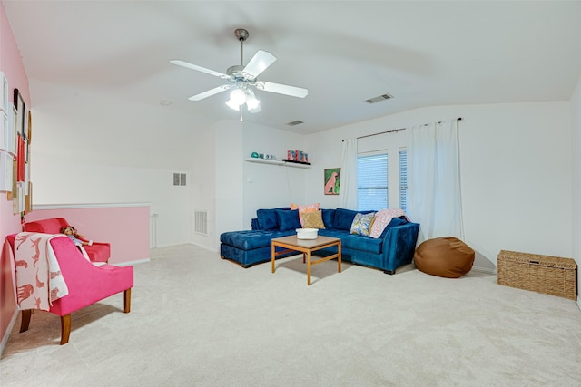 living room with carpet, ceiling fan, and vaulted ceiling