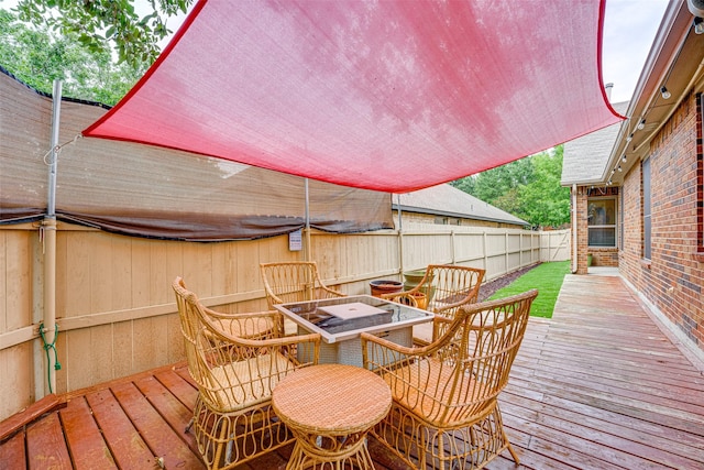 wooden deck with a fire pit