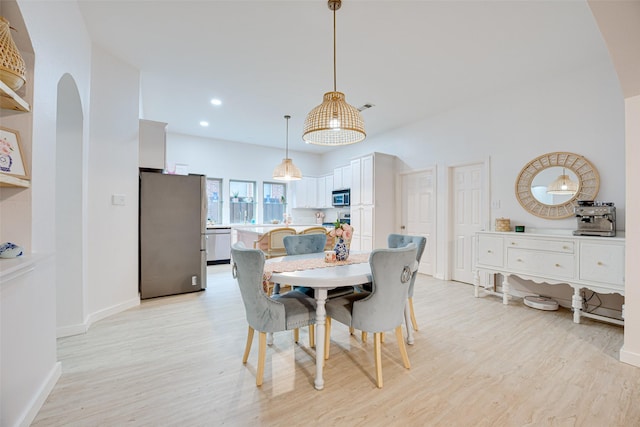 dining area with light hardwood / wood-style flooring