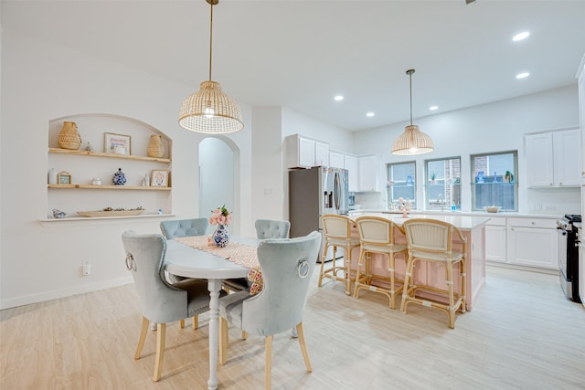 dining space featuring light hardwood / wood-style floors