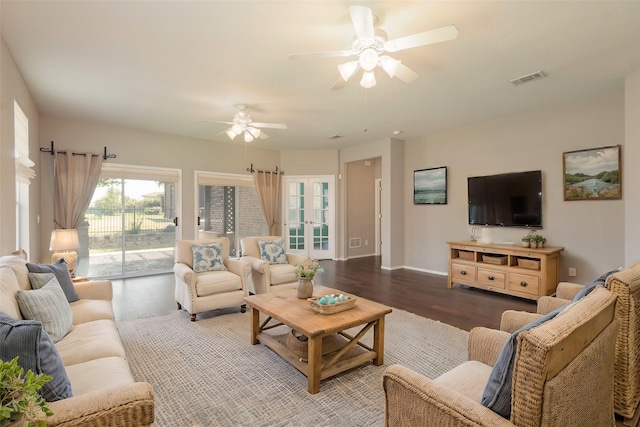 living room featuring hardwood / wood-style flooring, ceiling fan, and french doors