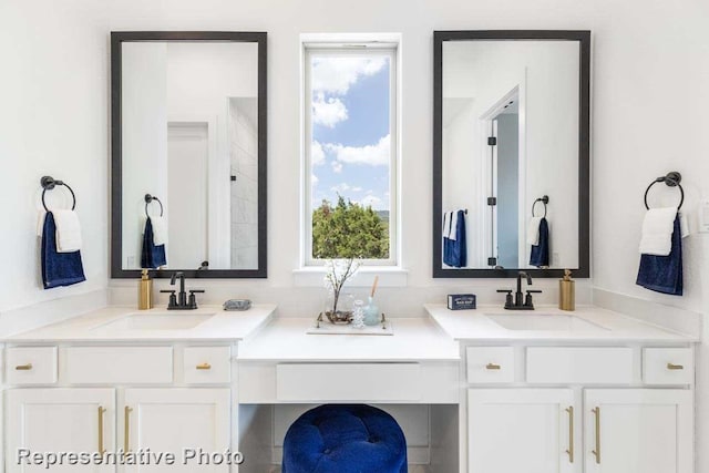 bathroom with plenty of natural light and vanity