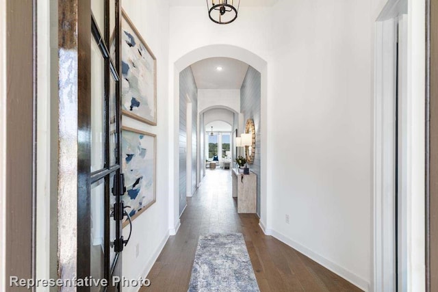 hall with dark hardwood / wood-style flooring