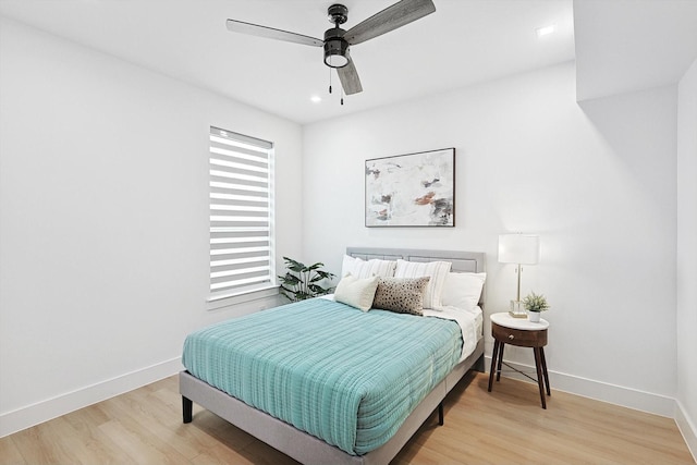 bedroom featuring hardwood / wood-style floors and ceiling fan