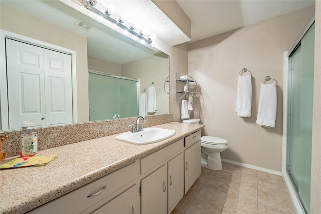 bathroom with walk in shower, vanity, toilet, and tile patterned flooring