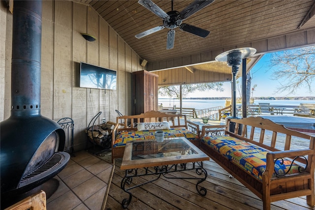interior space with ceiling fan