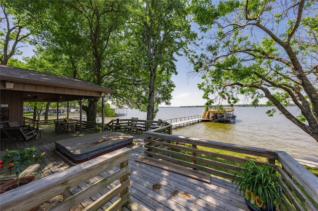 deck featuring a water view and a dock