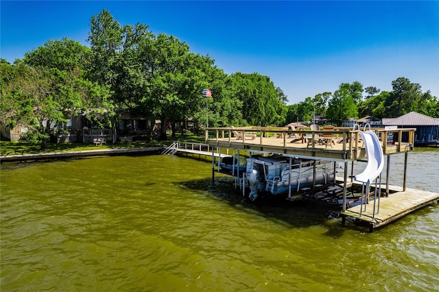 view of dock with a water view and boat lift