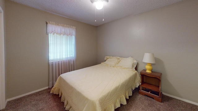 carpeted bedroom with a textured ceiling