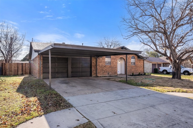 ranch-style house with a carport and a front lawn