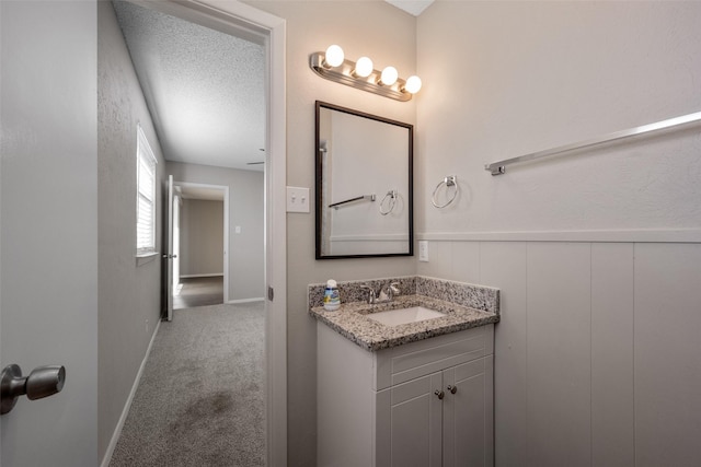 bathroom with vanity and a textured ceiling