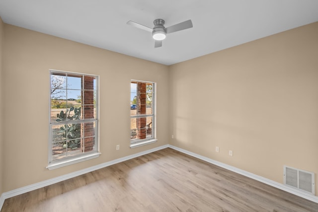 spare room featuring ceiling fan and light hardwood / wood-style flooring