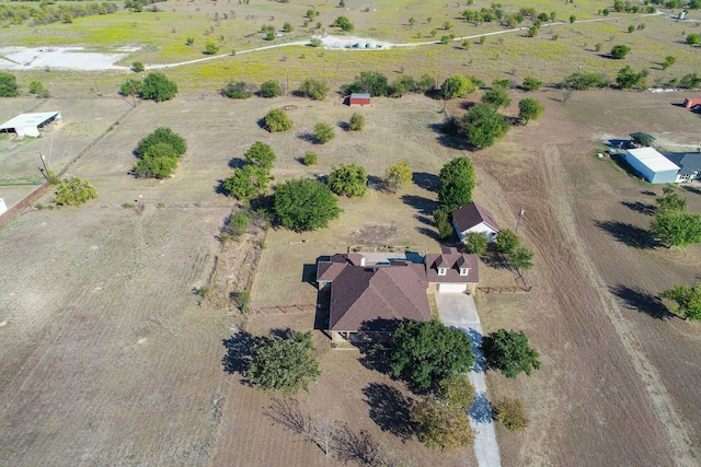 birds eye view of property with a rural view