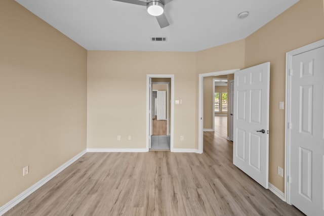 unfurnished bedroom featuring ceiling fan and light hardwood / wood-style floors