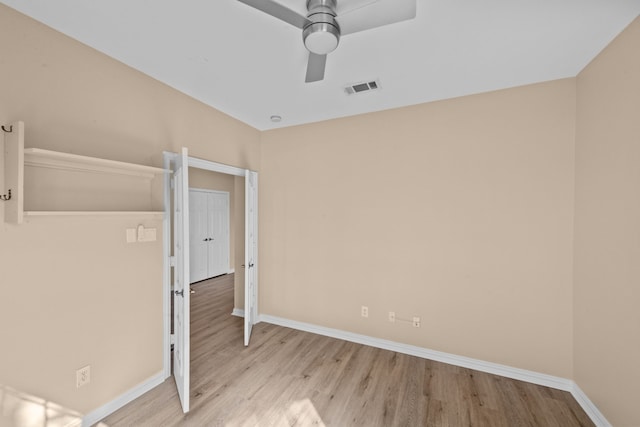 unfurnished bedroom with ceiling fan and light hardwood / wood-style floors