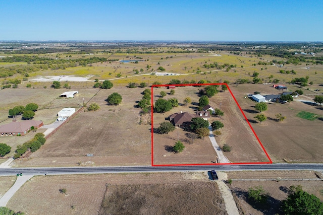 birds eye view of property with a rural view