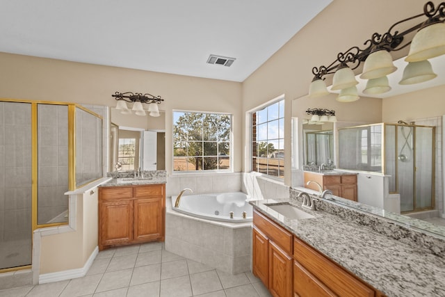 bathroom with vanity, separate shower and tub, and tile patterned flooring