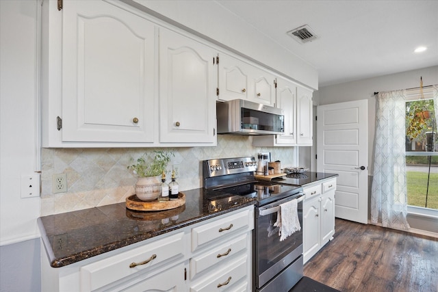 kitchen with white cabinetry, tasteful backsplash, and stainless steel appliances