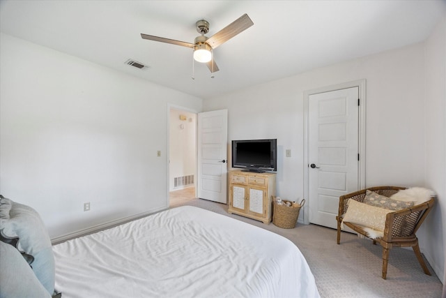 bedroom featuring light carpet and ceiling fan